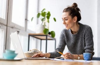 corporate-domain-registration-woman-working-on-her-laptop