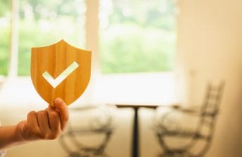 A person holding Secured shield